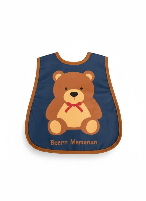Babero impermeable azul de Vamos Niños con estampado de osito marrón, ideal para proteger la ropa durante la comida.