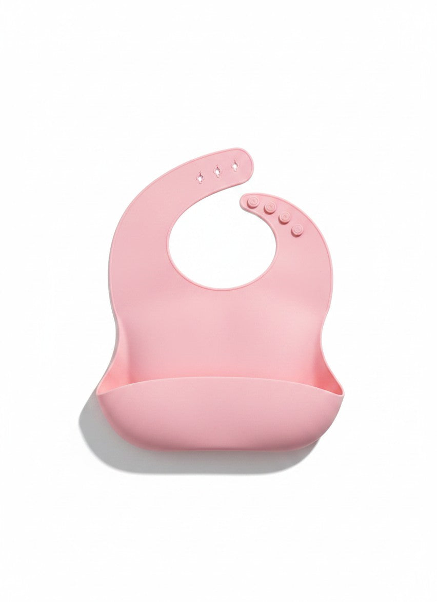 Babero de silicona rosa Vamos Niños con bolsillo recoge-migas y cierre ajustable para bebés
