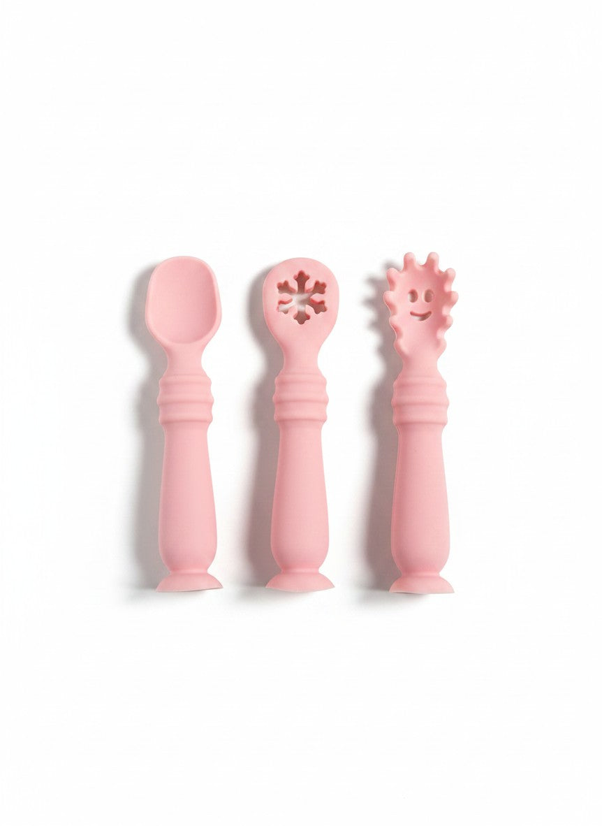 Set de cubiertos de silicona rosa Vamos Niños para bebés, incluye cuchara, tenedor y cuchara con diseño de copo.