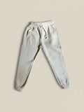 Pantalón de buzo unisex Vamos Niños Lefties en color beige con cintura elástica y cordón ajustable