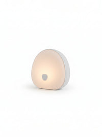 Lámpara de noche portátil Vamos Niños con luz LED cálida, diseño minimalista y control táctil para mesita de noche.