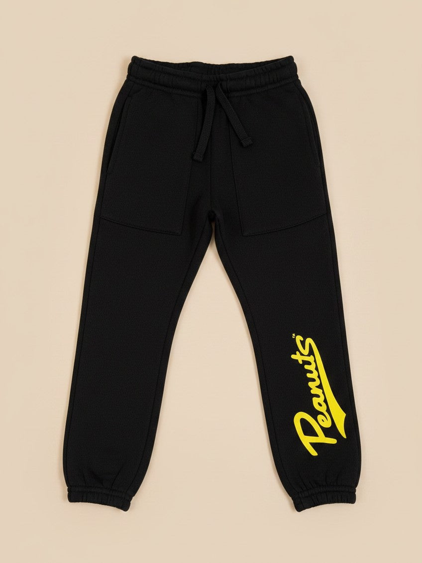 Pantalón de buzo negro unisex Vamos Niños Lefties con estampado amarillo de Peanuts y cintura elástica