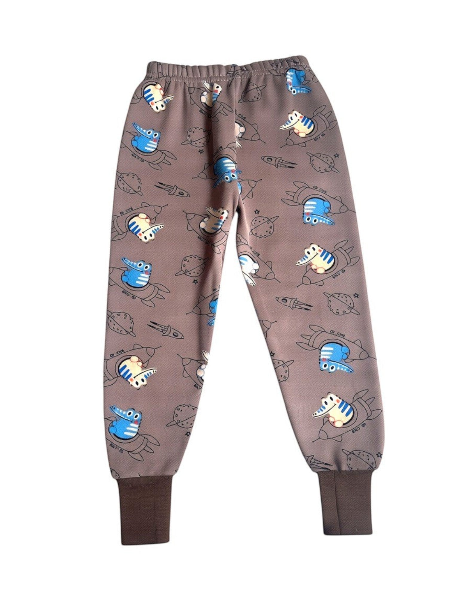 Pantalón de pijama afranelado Vamos Niños color café con estampado de dinosaurios en cohetes y puños elasticados