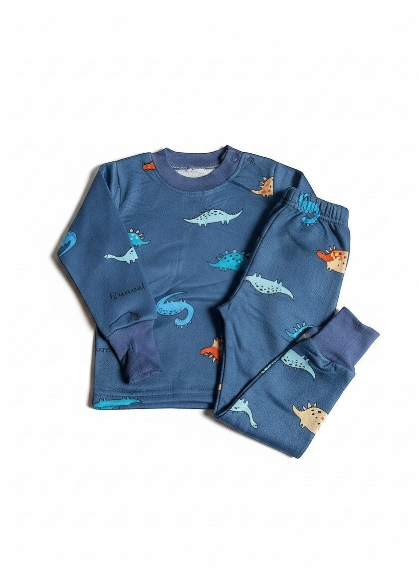 Pijama afranelado Vamos Niños de dos piezas en color azul con estampado de dinosaurios y puños elásticos suaves