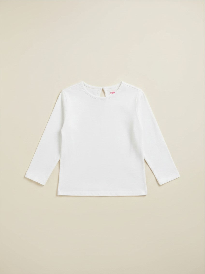Polera blanca unisex de manga larga marca Vamos Niños con detalle de abertura en la espalda