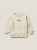 Polerón beige de niña Vamos Niños marca Lefties con estampado de letras negras en el pecho y cuello redondo