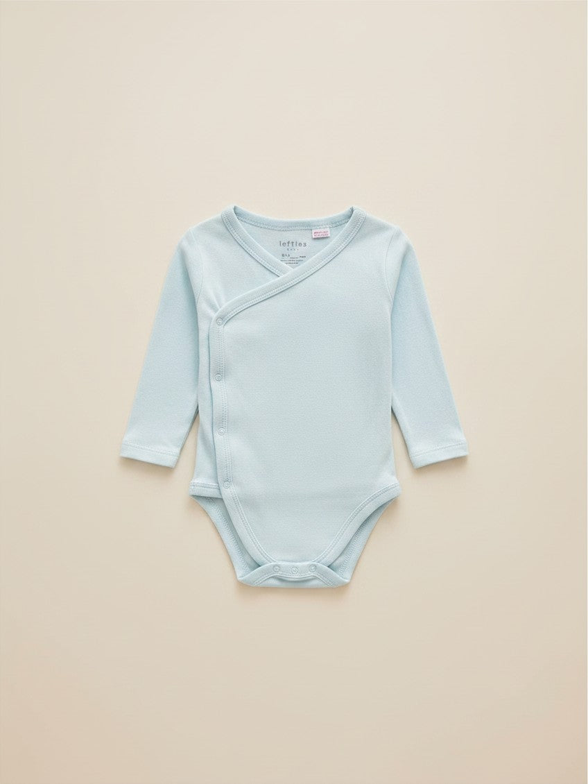 Set de 3 bodies unisex Vamos Niños de manga larga en colores celeste, damasco y blanco con estampado de estrellas