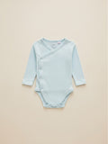 Set de 3 bodies unisex Vamos Niños de manga larga en colores celeste, damasco y blanco con estampado de estrellas