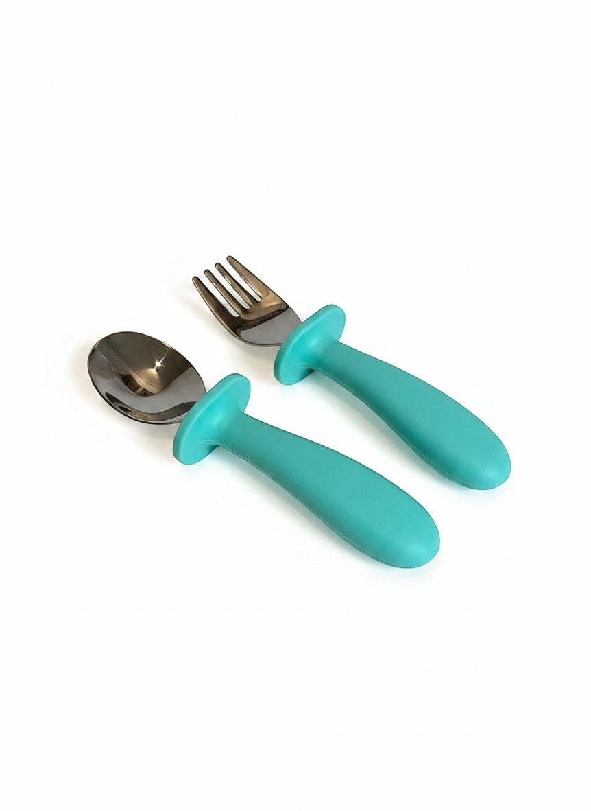 Set de cubiertos Vamos Niños con tenedor y cuchara de acero inoxidable y mangos ergonómicos de silicona color turquesa