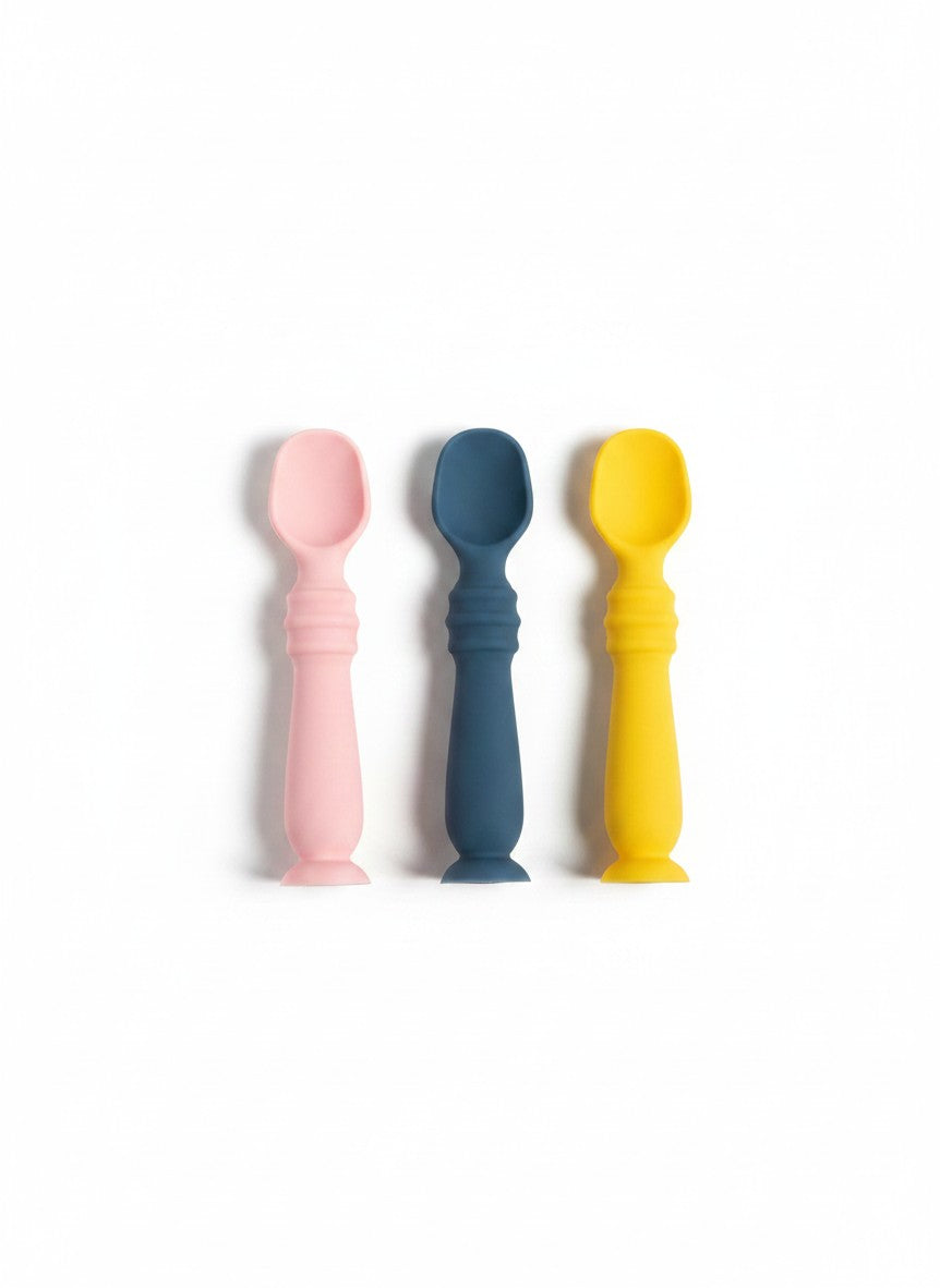 Set de tres cucharas de silicona Vamos Niños en colores rosa, azul y amarillo, ideales para bebés y alimentación.