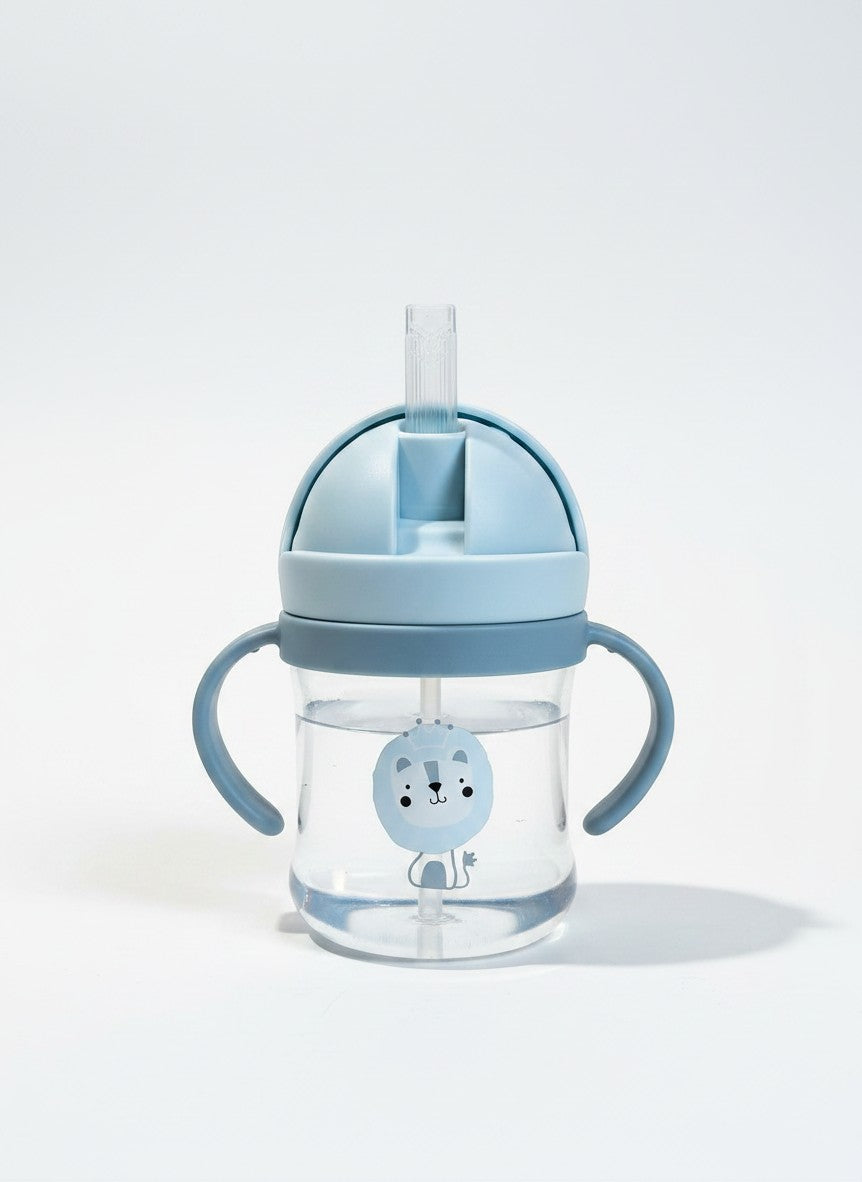 Vaso de aprendizaje Vamos Niños azul con pajita, asas ergonómicas y estampado de león para bebés.